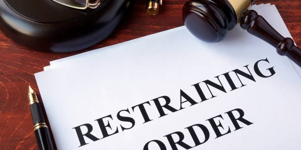 Restraining order and gavel.