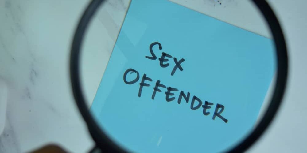 Sex offender written on sticky note.